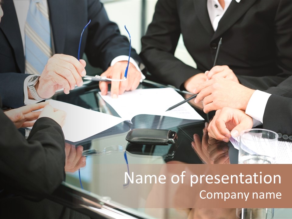 A Group Of Business People Sitting Around A Table PowerPoint Template