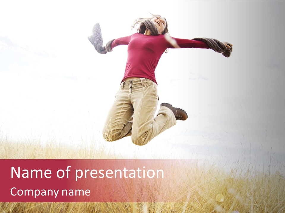 A Woman Jumping In The Air In A Field PowerPoint Template