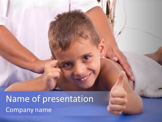 A Young Boy Is Smiling And Giving A Thumbs Up PowerPoint Template