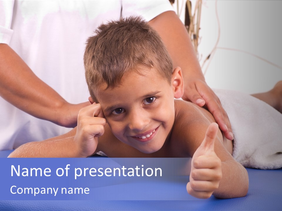 A Young Boy Is Smiling And Giving A Thumbs Up PowerPoint Template