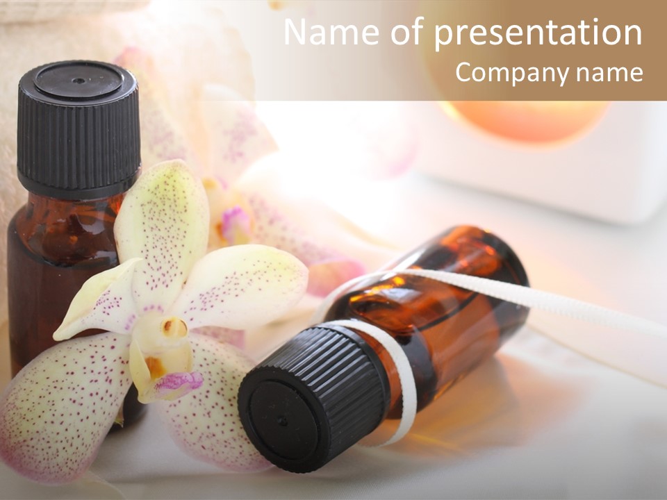 A Bottle Of Essential Oils Next To A Flower PowerPoint Template