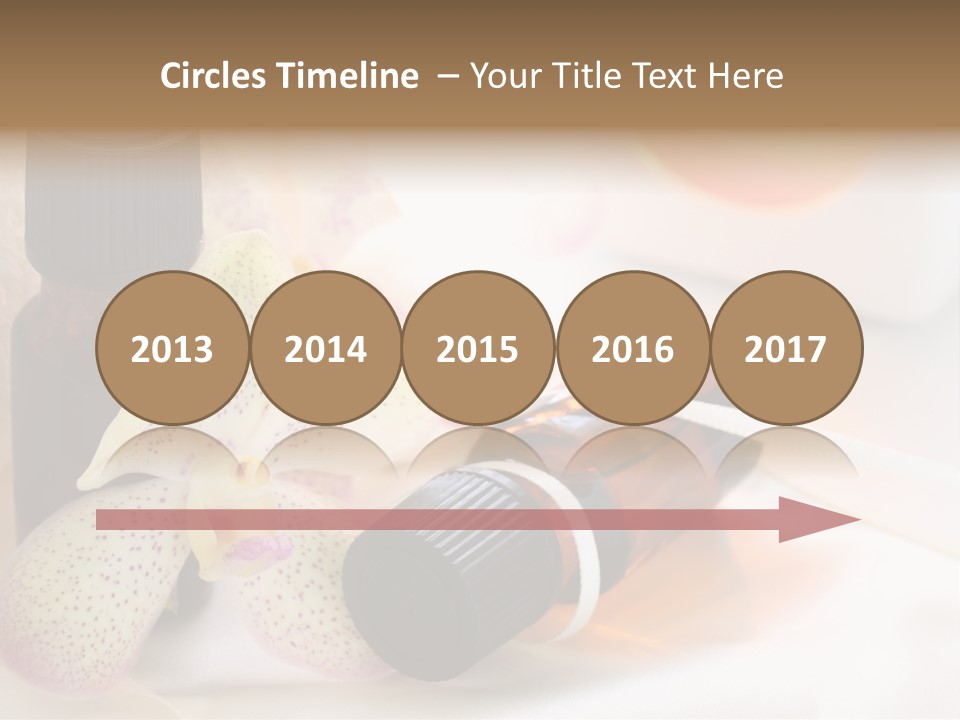 A Bottle Of Essential Oils Next To A Flower PowerPoint Template