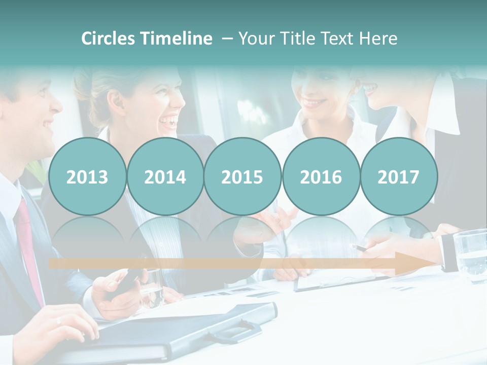 A Group Of People Sitting Around A Table Talking PowerPoint Template