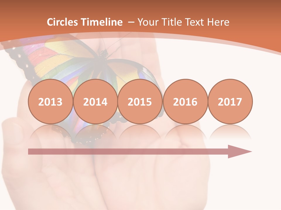 A Person Holding A Colorful Butterfly In Their Hands PowerPoint Template