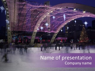A Group Of People Skating On An Ice Rink PowerPoint Template