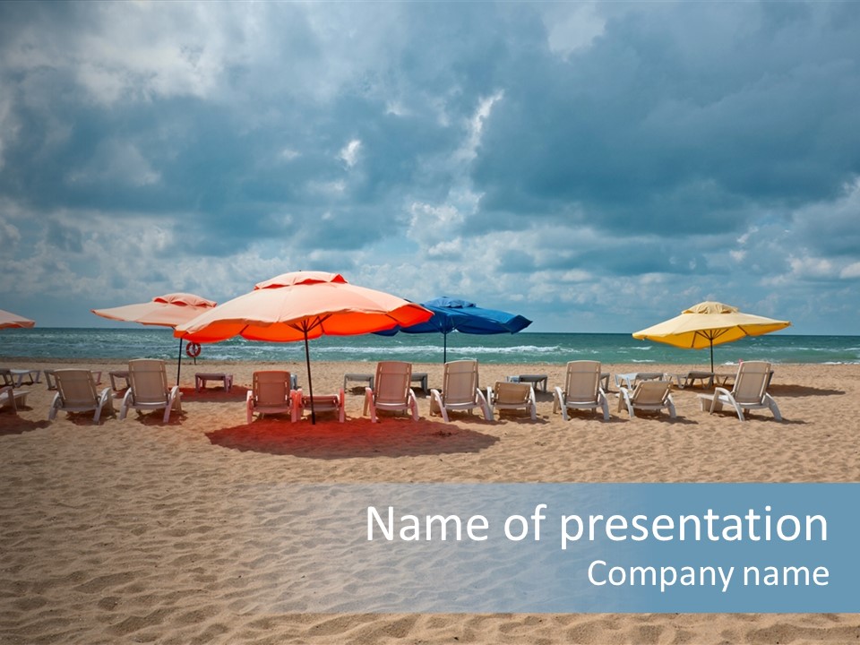 A Group Of Chairs And Umbrellas On A Beach PowerPoint Template