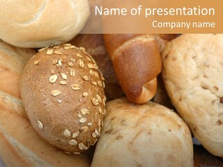 A Bunch Of Breads And Rolls On A Plate PowerPoint Template