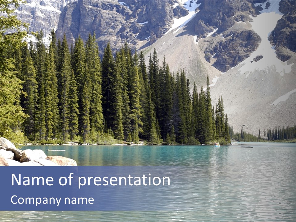 A Mountain Lake Surrounded By Pine Trees With A Blue Sky PowerPoint Template