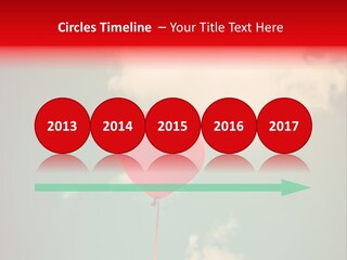 A Red Heart Shaped Balloon Floating In The Air PowerPoint Template