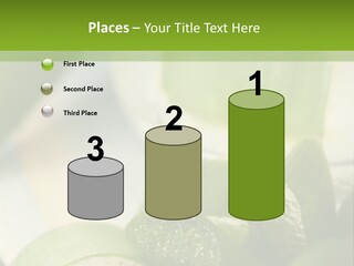A Glass Filled With Green Liquid Next To Sliced Cucumbers PowerPoint Template