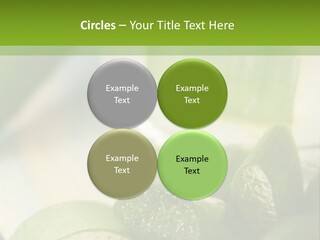 A Glass Filled With Green Liquid Next To Sliced Cucumbers PowerPoint Template