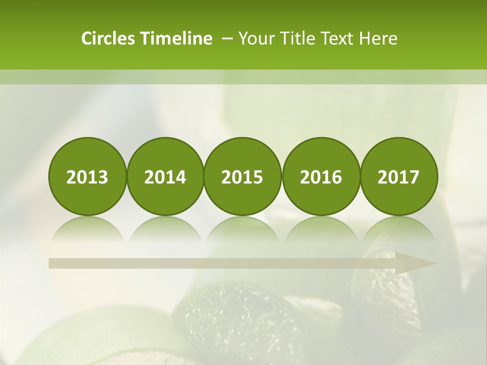 A Glass Filled With Green Liquid Next To Sliced Cucumbers PowerPoint Template