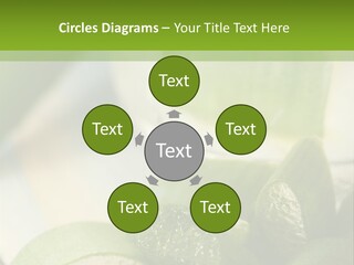 A Glass Filled With Green Liquid Next To Sliced Cucumbers PowerPoint Template