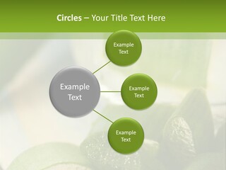A Glass Filled With Green Liquid Next To Sliced Cucumbers PowerPoint Template