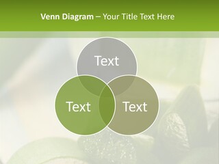 A Glass Filled With Green Liquid Next To Sliced Cucumbers PowerPoint Template