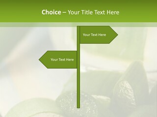 A Glass Filled With Green Liquid Next To Sliced Cucumbers PowerPoint Template