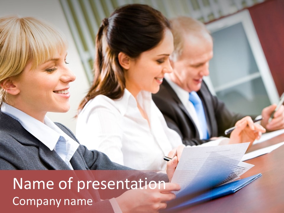 A Group Of Business People Sitting At A Table PowerPoint Template