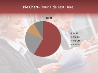 A Group Of Business People Sitting At A Table PowerPoint Template