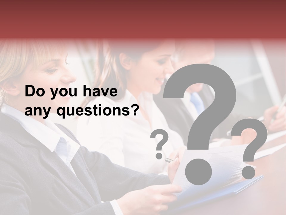 A Group Of Business People Sitting At A Table PowerPoint Template