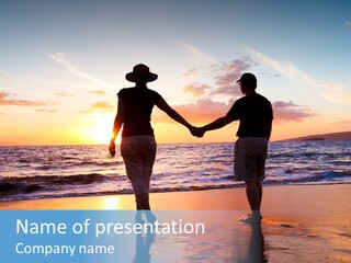 Two People Holding Hands On A Beach At Sunset PowerPoint Template