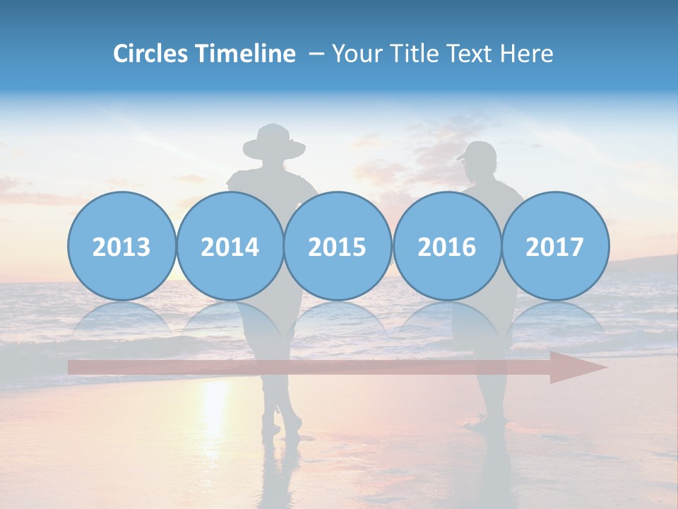 Two People Holding Hands On A Beach At Sunset PowerPoint Template