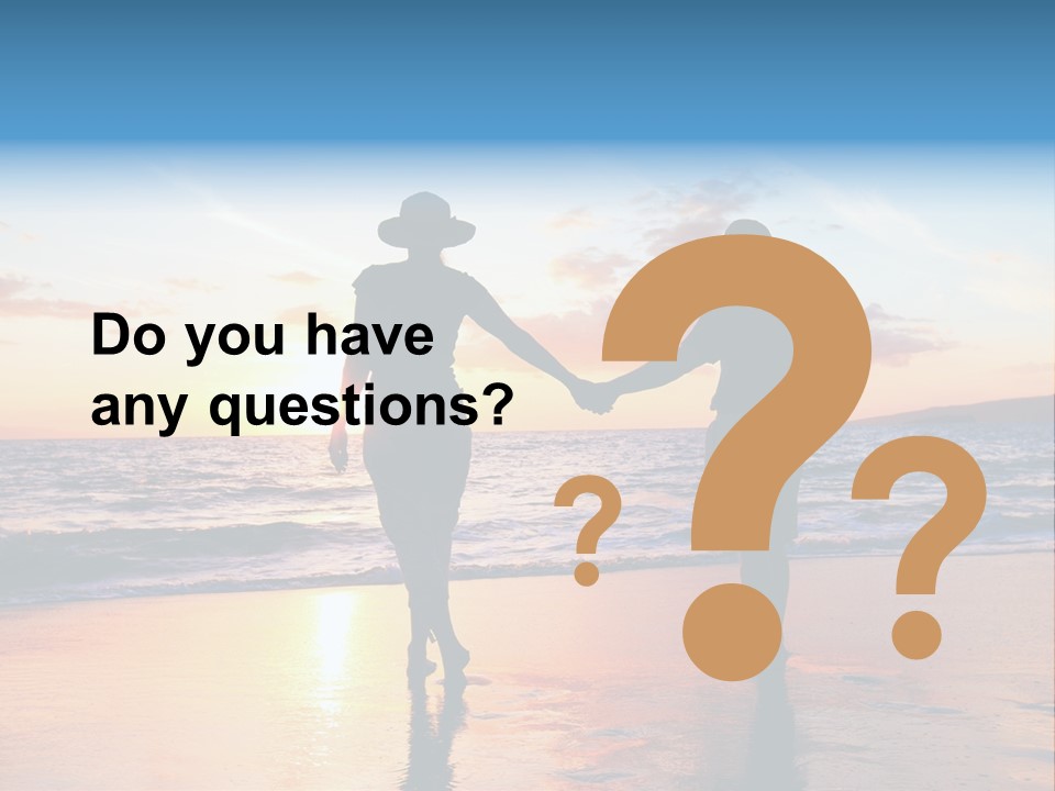 Two People Holding Hands On A Beach At Sunset PowerPoint Template