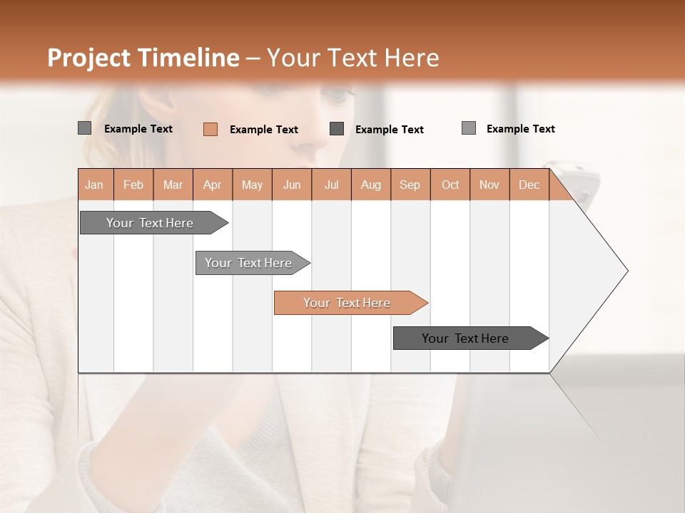 A Woman Sitting At A Table Using A Laptop Computer PowerPoint Template