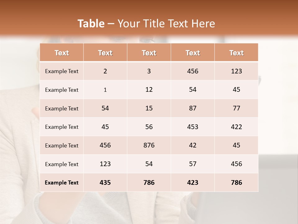 A Woman Sitting At A Table Using A Laptop Computer PowerPoint Template