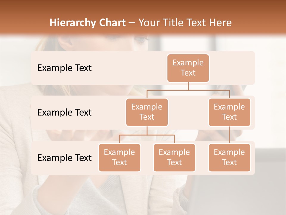 A Woman Sitting At A Table Using A Laptop Computer PowerPoint Template