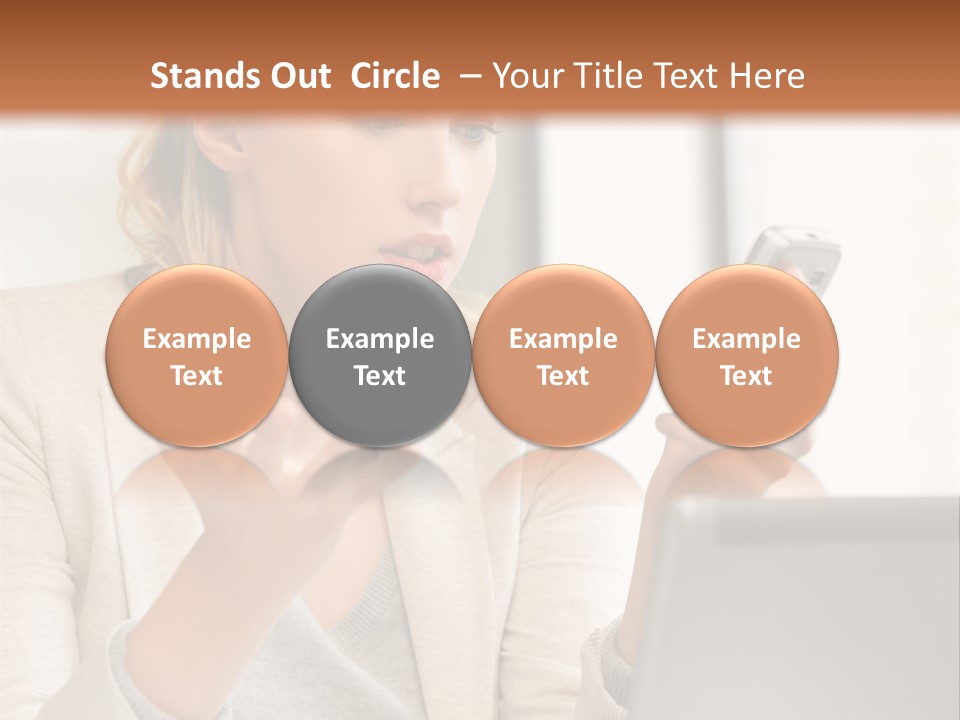 A Woman Sitting At A Table Using A Laptop Computer PowerPoint Template