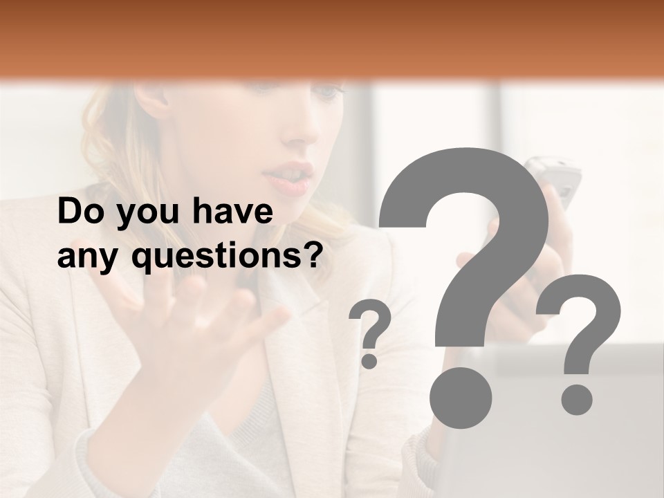 A Woman Sitting At A Table Using A Laptop Computer PowerPoint Template