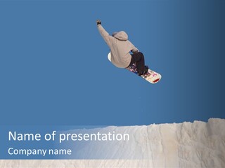 A Snowboarder In The Air Doing A Trick PowerPoint Template