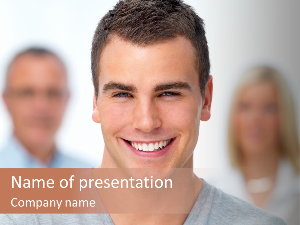 A Man Smiling With A Group Of People Behind Him PowerPoint Template