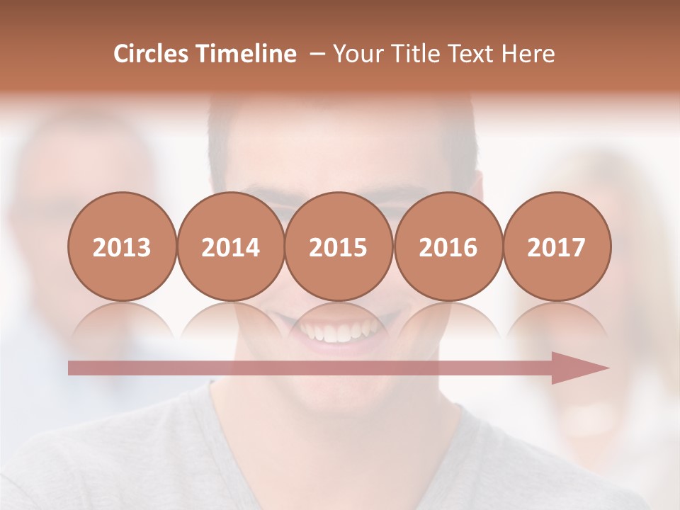 A Man Smiling With A Group Of People Behind Him PowerPoint Template