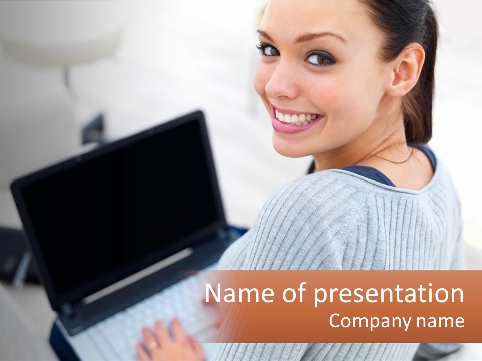 A Woman Holding A Laptop Computer In Her Hands PowerPoint Template