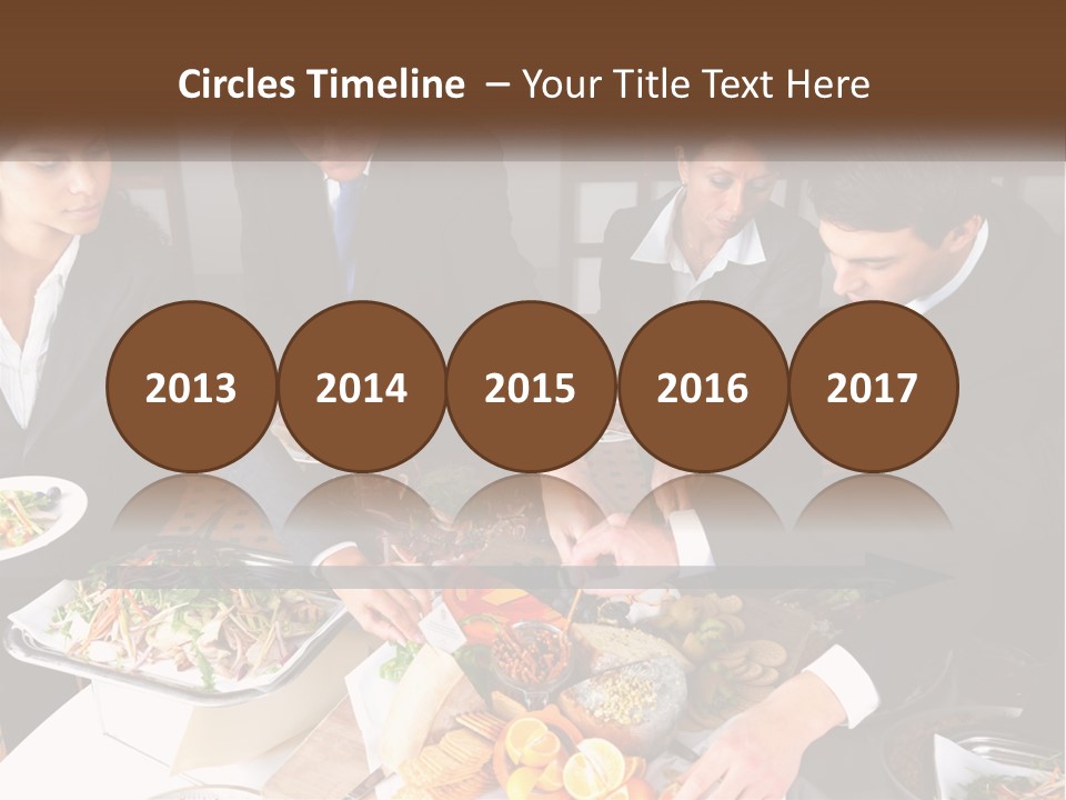A Group Of People Standing Around A Table With Plates Of Food PowerPoint Template