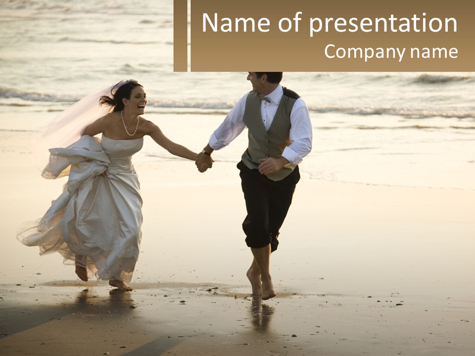 A Bride And Groom Walking On The Beach Holding Hands PowerPoint Template