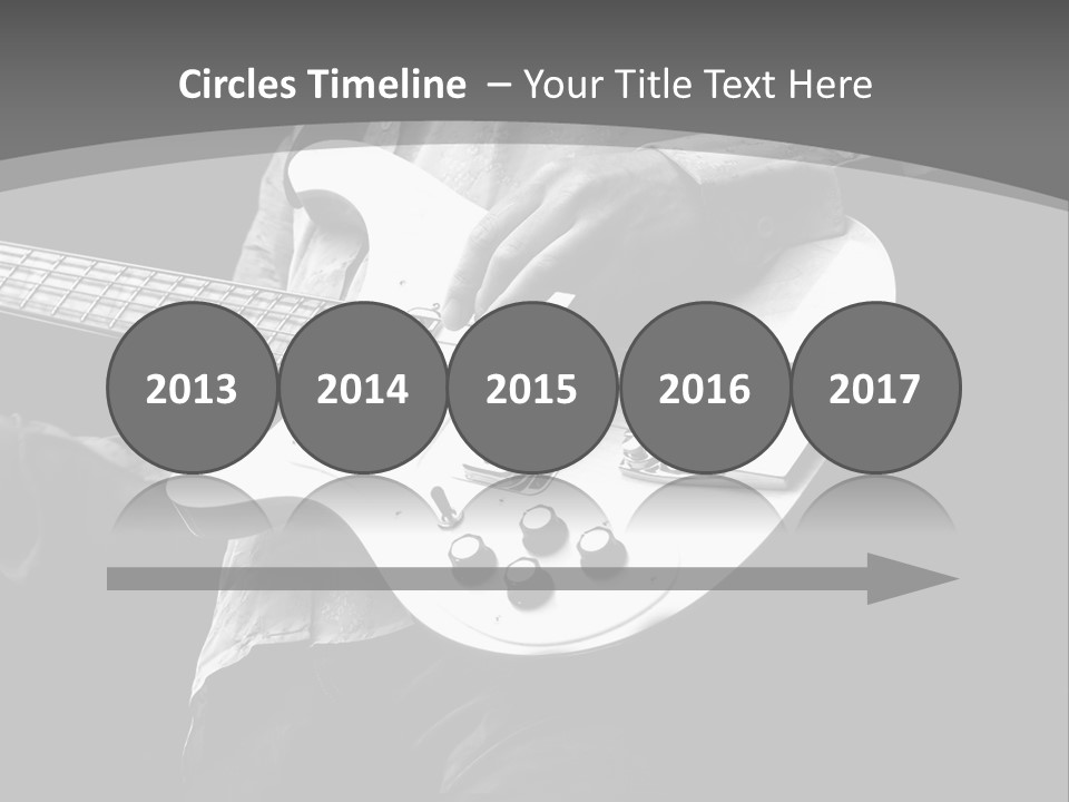 A Black And White Photo Of A Man Playing A Bass Guitar PowerPoint Template