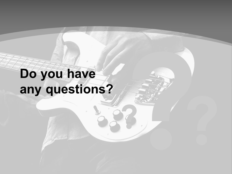 A Black And White Photo Of A Man Playing A Bass Guitar PowerPoint Template