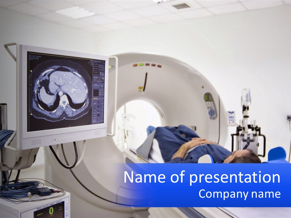 A Man Laying In A Hospital Bed In Front Of A Monitor PowerPoint Template