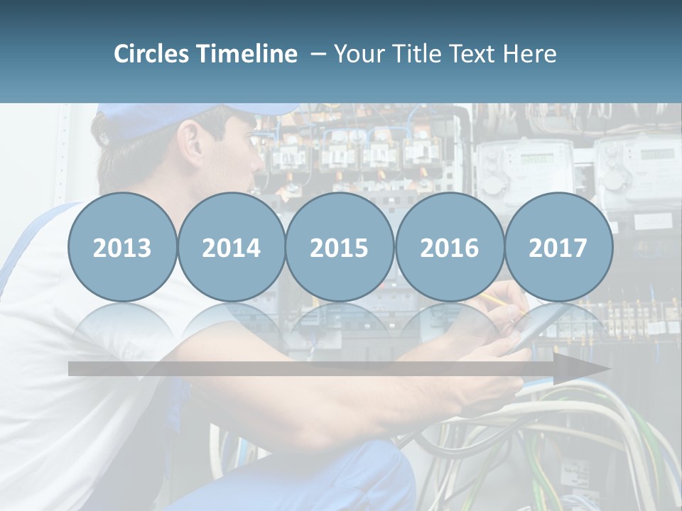 A Man In Overalls And A Blue Cap Is Working On An Electrical Panel PowerPoint Template