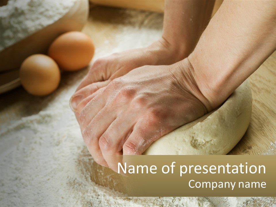 A Person Kneading Dough On Top Of A Wooden Table PowerPoint Template