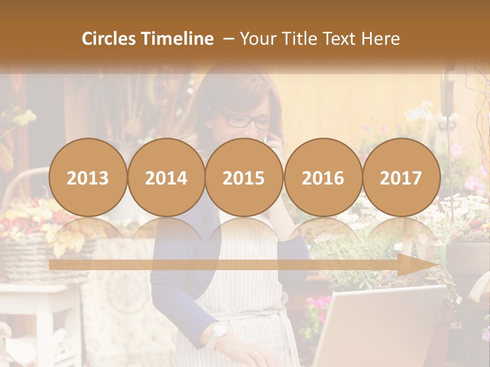 A Woman Talking On A Cell Phone In A Flower Shop PowerPoint Template