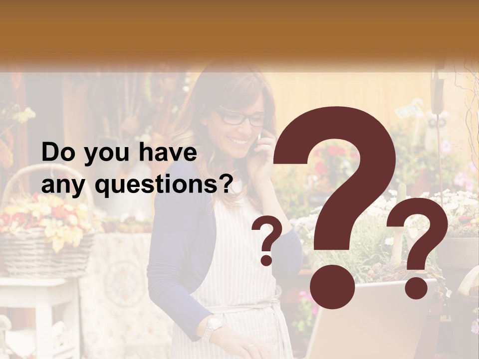 A Woman Talking On A Cell Phone In A Flower Shop PowerPoint Template