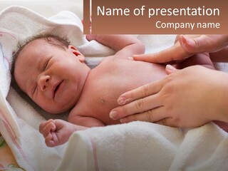 A Baby Laying On A Blanket Being Held By A Person PowerPoint Template