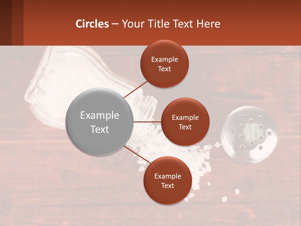 A Salt Shaker And A Scoop Of Salt On A Wooden Table PowerPoint Template