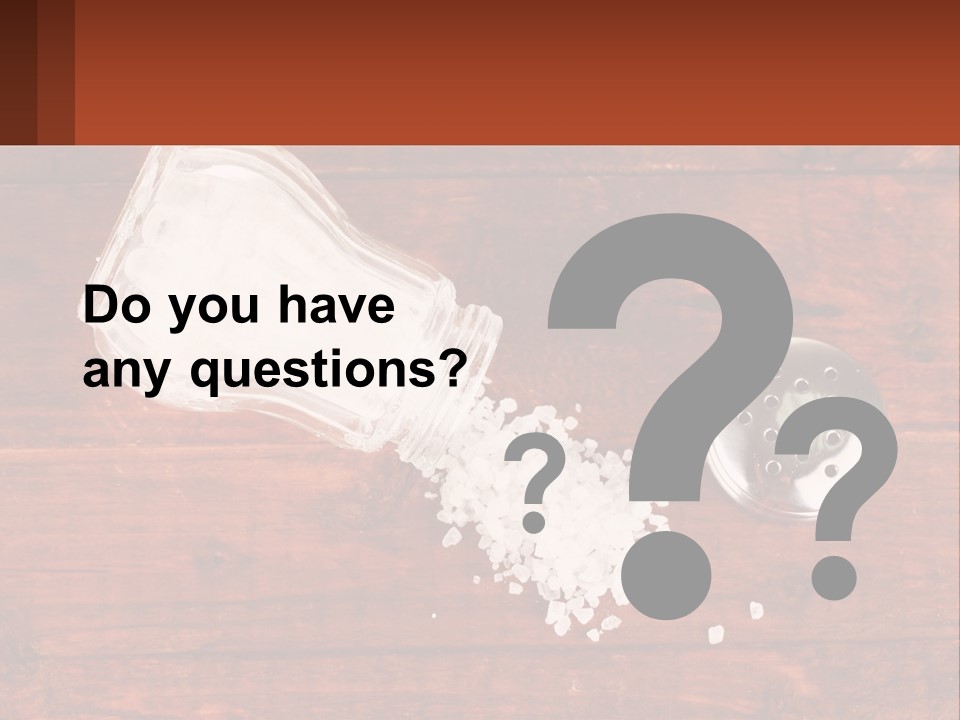 A Salt Shaker And A Scoop Of Salt On A Wooden Table PowerPoint Template