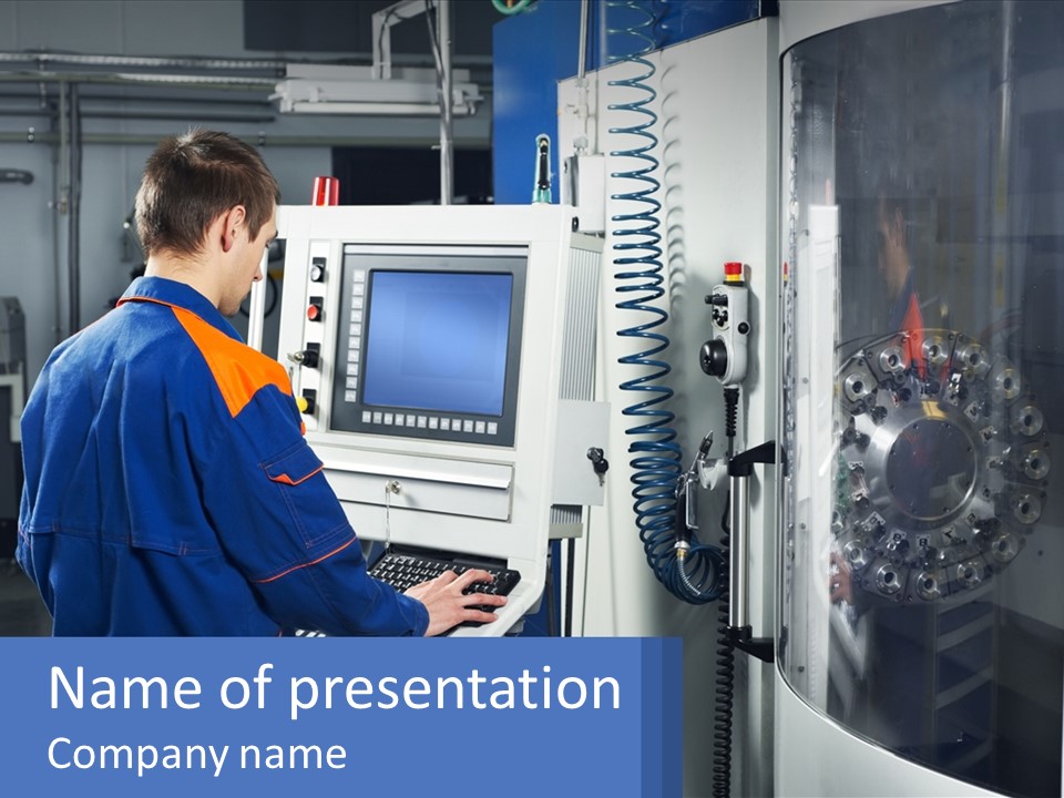 A Man Working On A Machine In A Factory PowerPoint Template