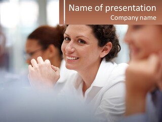 A Woman Sitting In Front Of A Group Of People PowerPoint Template