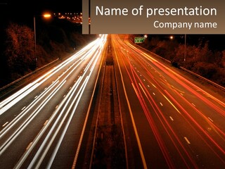 A Long Exposure Picture Of A Highway At Night PowerPoint Template